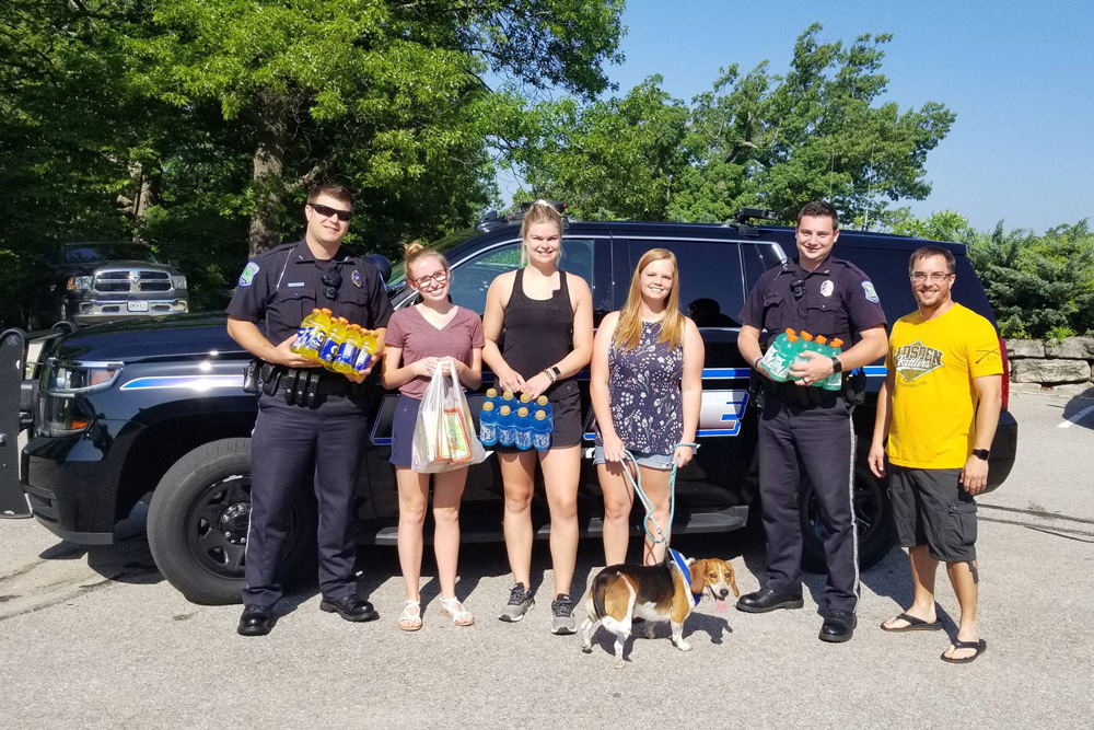 Members of MSW Team delivering drinks to Lake of the Ozarks Firefighters during a very hot day.  MSW team (left to right) – Katlyn Bartels, Abby Hetlage, Chasiti Begley, Keith Lucas.